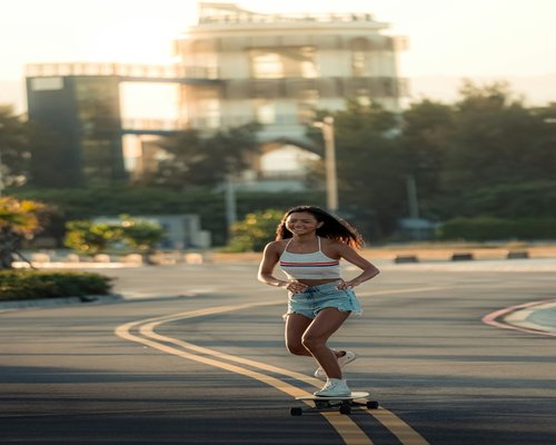 Happy active woman walking outside enjoying healthy lifestyle